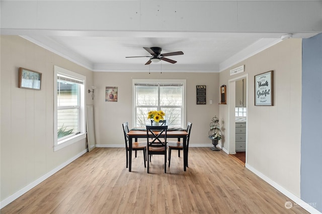 dining space with ceiling fan, light hardwood / wood-style floors, and crown molding