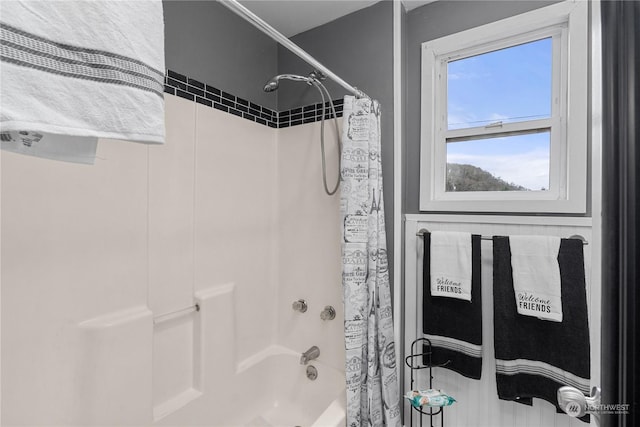 bathroom with shower / bathtub combination with curtain