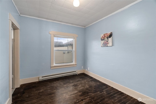 unfurnished room featuring ornamental molding, dark wood-type flooring, and a baseboard heating unit