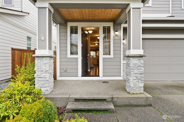 view of exterior entry featuring a garage