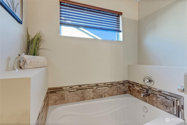 bathroom with a tub to relax in