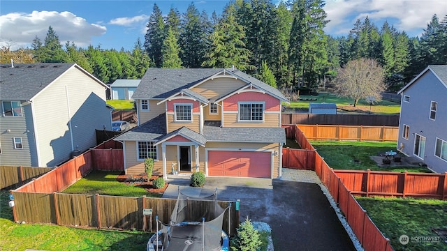 view of front of home featuring a garage and a front lawn