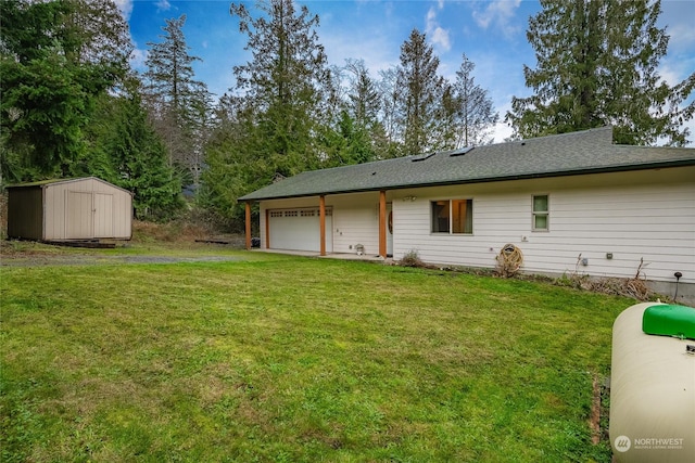 exterior space featuring a storage unit, a garage, and a front yard