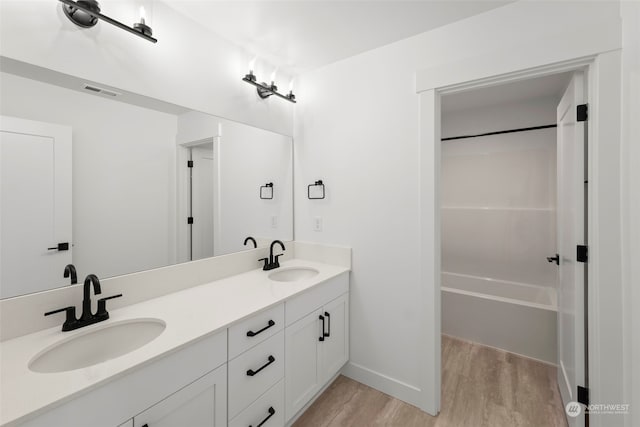 bathroom featuring hardwood / wood-style floors and vanity