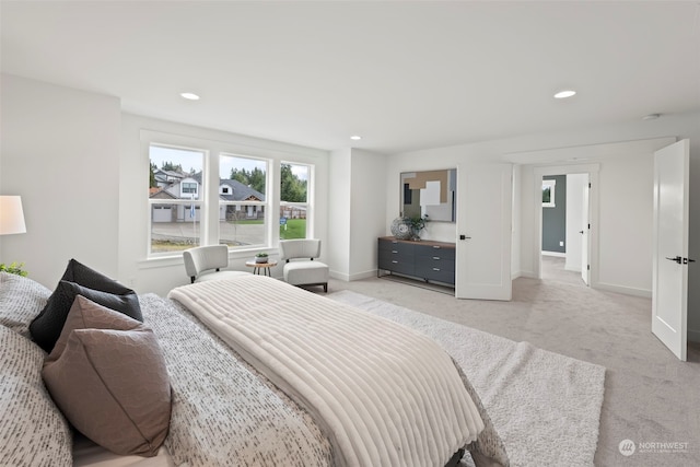 bedroom with light colored carpet