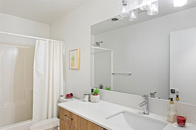 bathroom with toilet, vanity, and a shower with curtain