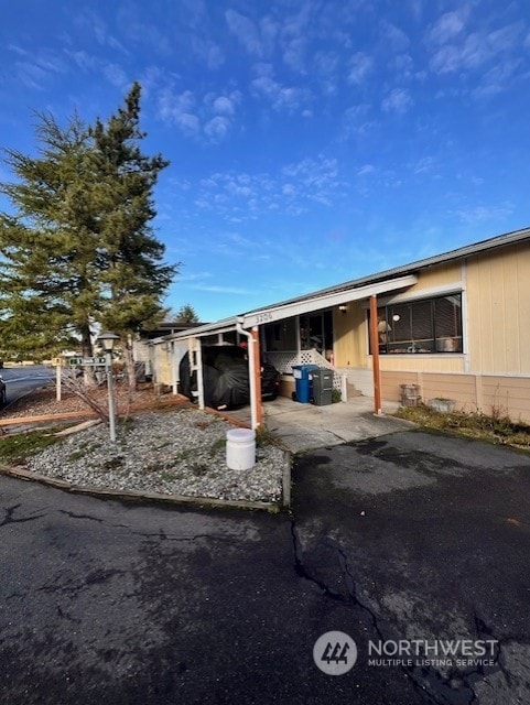 exterior space featuring a carport