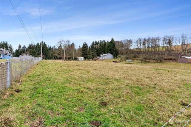 view of yard with a rural view