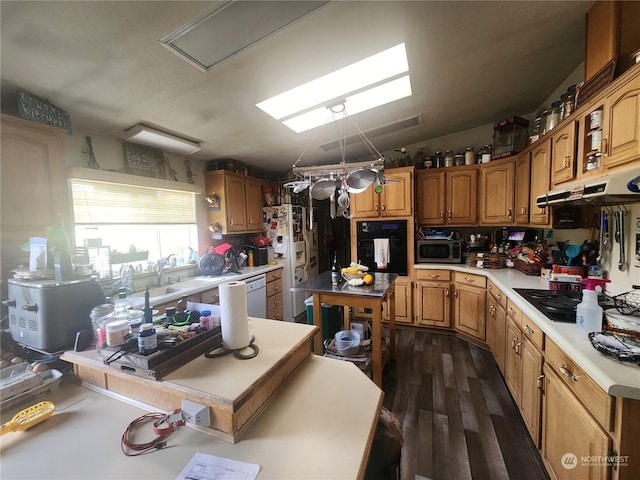 kitchen featuring dark wood-type flooring and black appliances