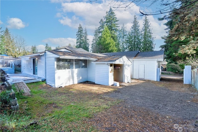 view of front of house featuring fence