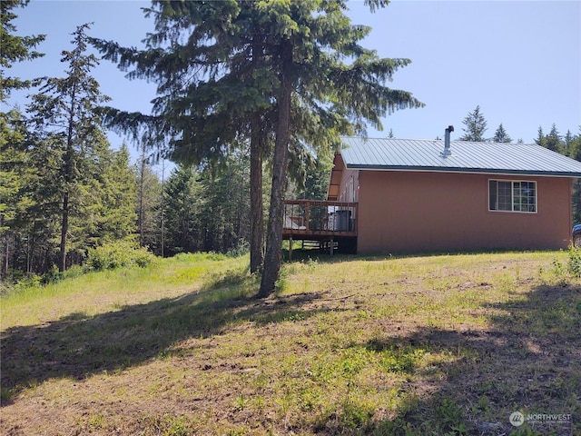 view of yard featuring a wooden deck