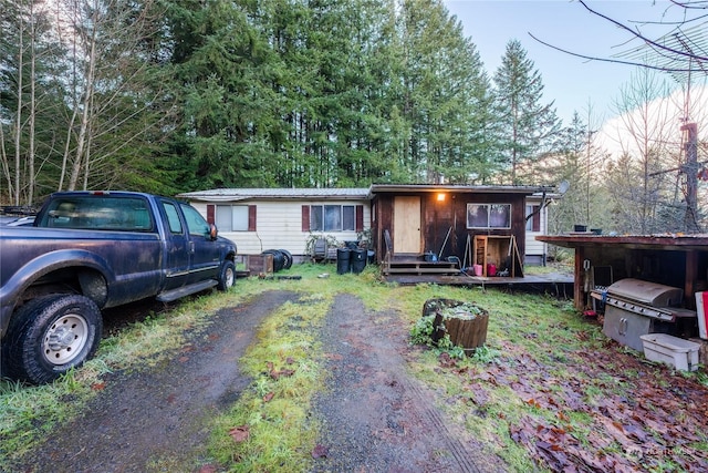 view of front of home featuring a carport