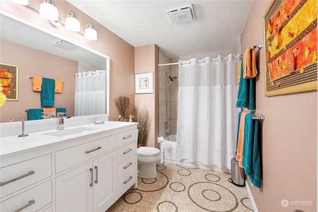 full bathroom featuring vanity, toilet, and shower / bath combo with shower curtain