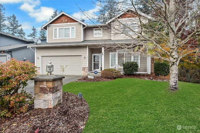 view of front of property featuring a front lawn and a garage