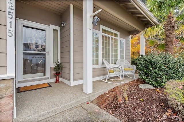 doorway to property featuring a porch