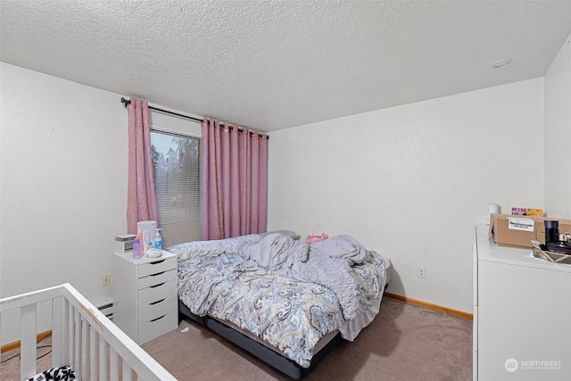 carpeted bedroom featuring a textured ceiling