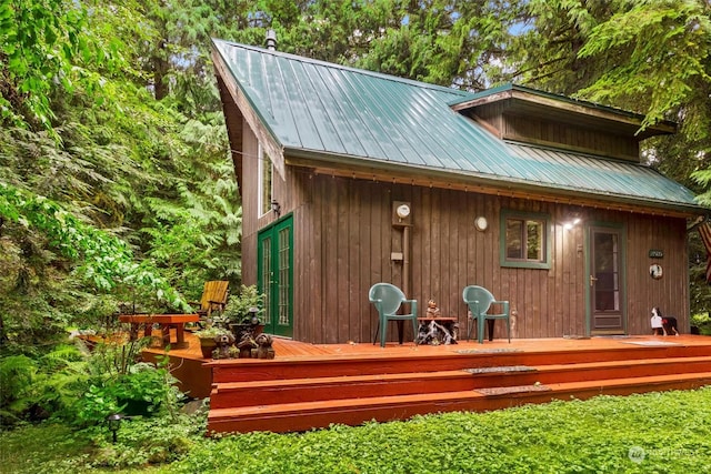 back of house featuring a wooden deck