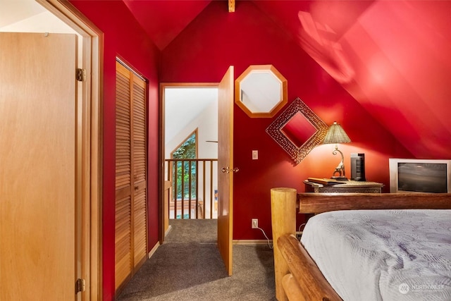 bedroom featuring vaulted ceiling and carpet