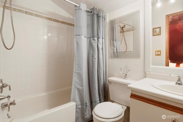 full bathroom with vanity, shower / tub combo, and toilet