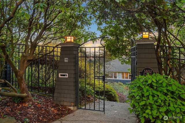 view of gate at dusk