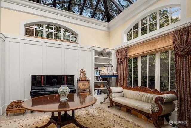 sitting room with a towering ceiling and a wealth of natural light