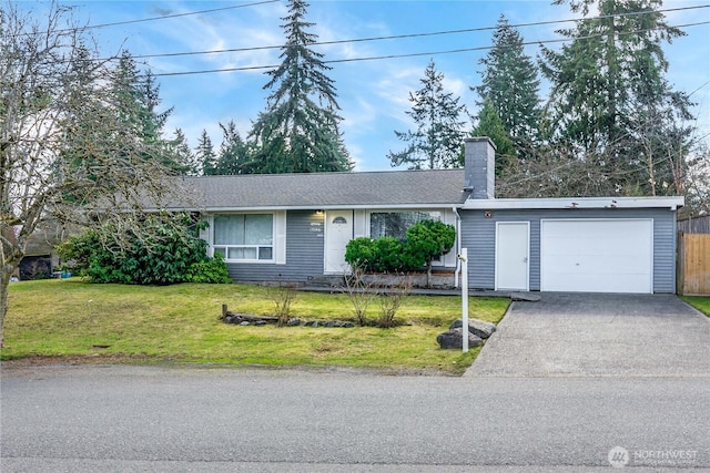 single story home with aphalt driveway, a chimney, a front yard, fence, and a garage