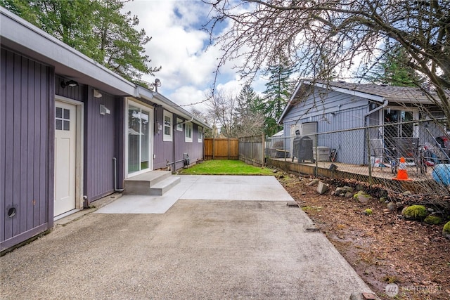 view of yard featuring entry steps, a patio area, and fence