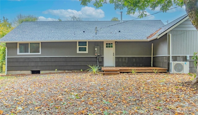 rear view of house featuring ac unit