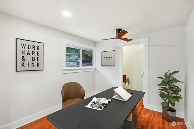 office space with ceiling fan and dark wood-type flooring