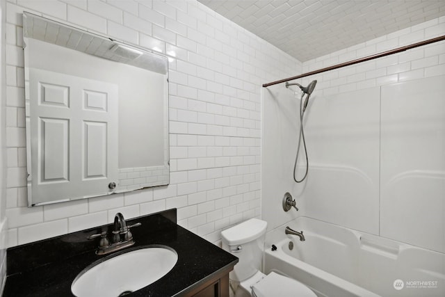 full bathroom with shower / tub combination, tile walls, decorative backsplash, vanity, and toilet