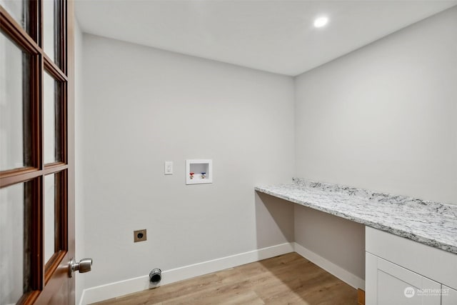 laundry area with light hardwood / wood-style floors, hookup for a washing machine, and electric dryer hookup