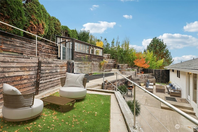 view of yard with an outdoor living space and a patio