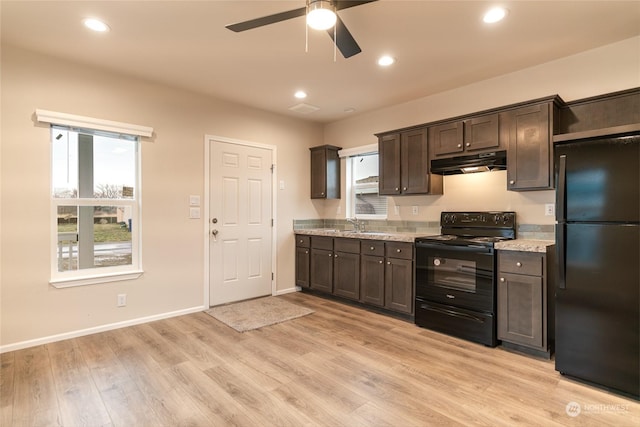 kitchen featuring dark brown cabinets, light wood-type flooring, ceiling fan, and black appliances