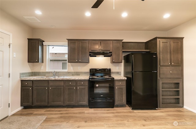 kitchen with dark brown cabinets, ceiling fan, sink, black appliances, and light hardwood / wood-style floors