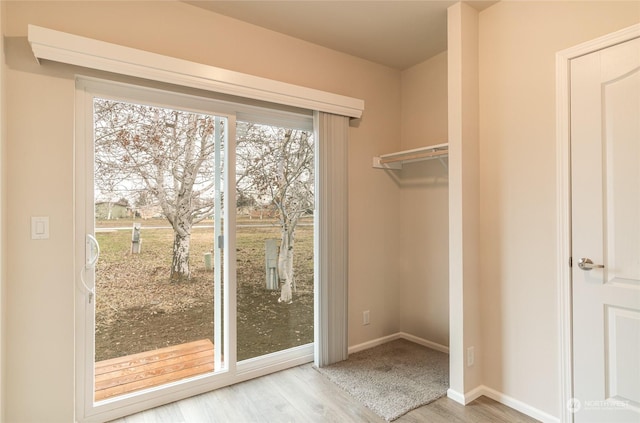 doorway to outside featuring light hardwood / wood-style flooring