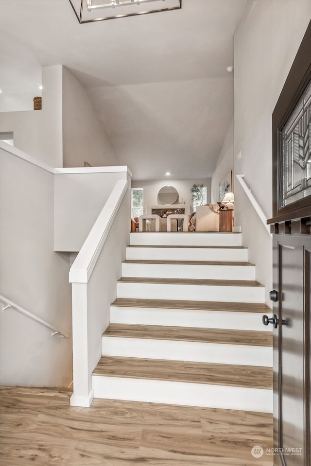 stairs with hardwood / wood-style floors