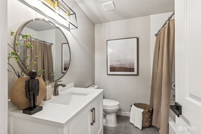 bathroom with toilet, tile patterned flooring, vanity, and curtained shower