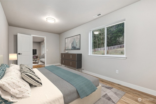 bedroom with light hardwood / wood-style floors