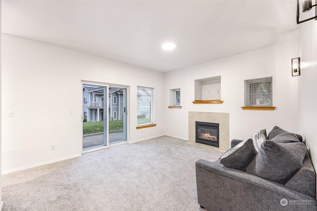 carpeted living room with a fireplace