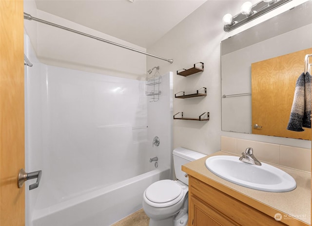 full bathroom featuring vanity, toilet, washtub / shower combination, and tasteful backsplash