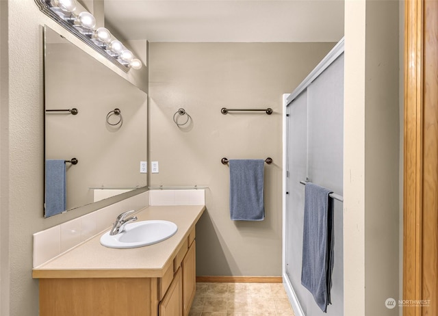 bathroom featuring tile patterned floors and vanity