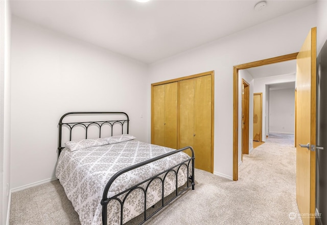 carpeted bedroom with a closet