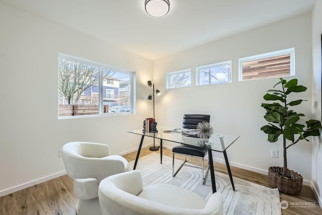 office area with hardwood / wood-style floors