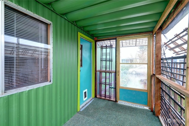 sunroom / solarium with beamed ceiling