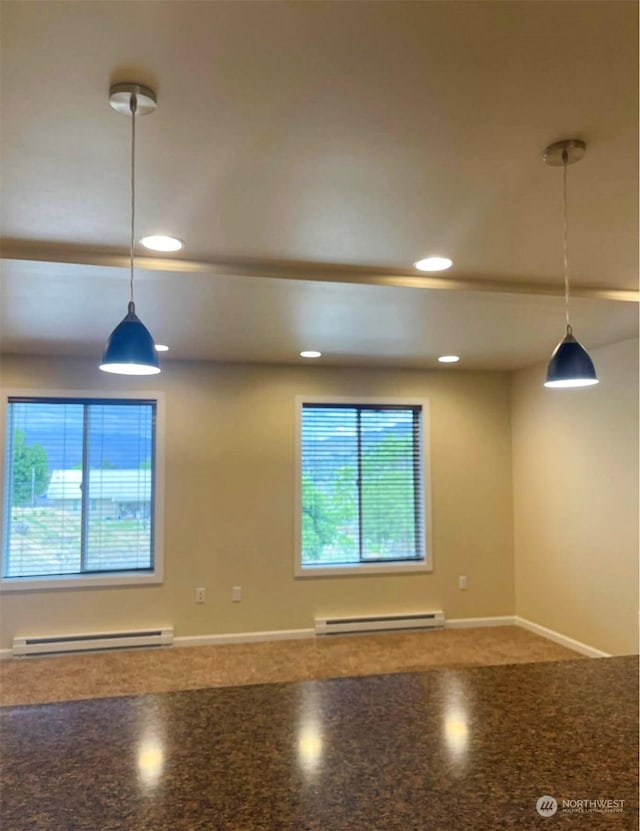 interior space featuring pendant lighting and a baseboard radiator