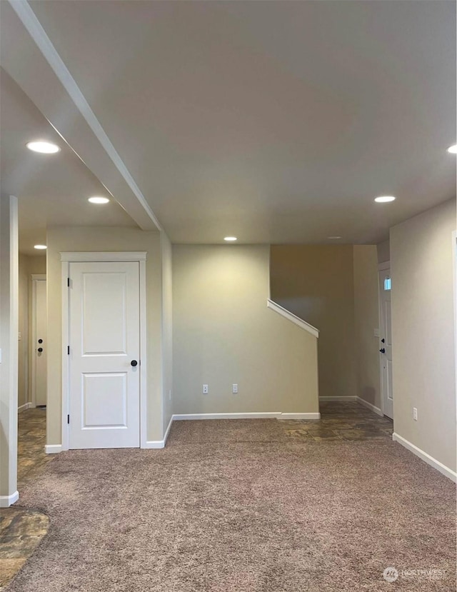 basement with dark carpet