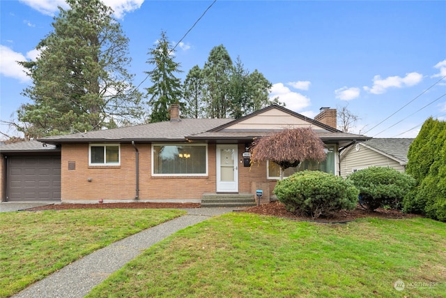 view of front of house with a front lawn and a garage