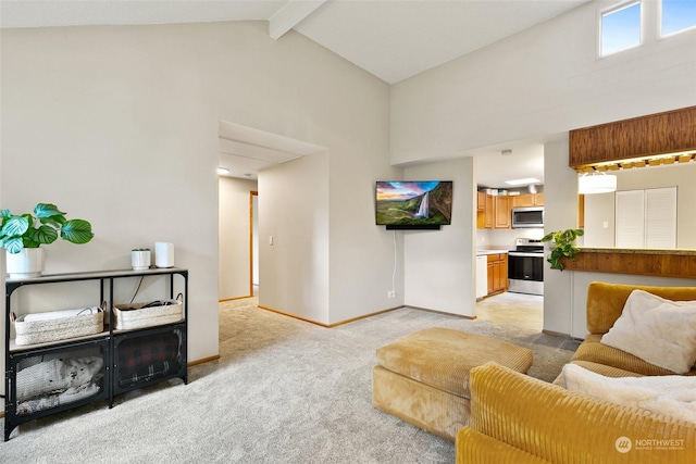 carpeted living room with beamed ceiling and high vaulted ceiling