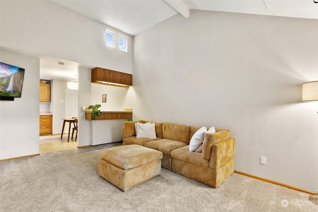 carpeted living room with lofted ceiling with beams