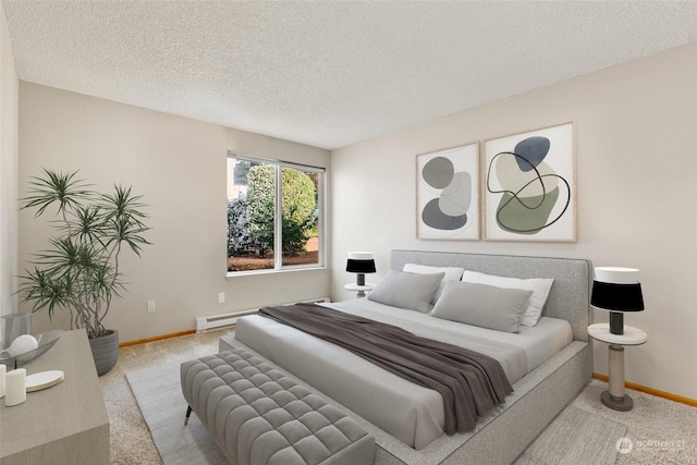 carpeted bedroom with a textured ceiling and baseboard heating